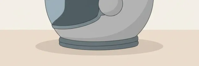 A single empty space helmet resting on a pale neutral surface, flat vector illustration in muted greys and soft blue.